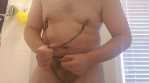Chub rubbing his cock and playing with nipple clamps