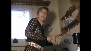 Grandma in tights jerking off in the kitchen