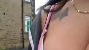 Sexy brunette with jiggling tits outdoors