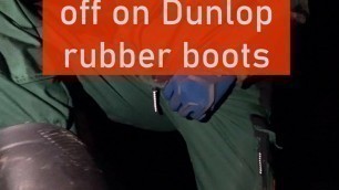 worker jerking of on Dunlop rubber boots