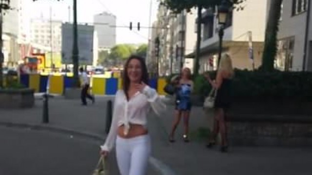 hooker walking in the street in sexy high heels and legging