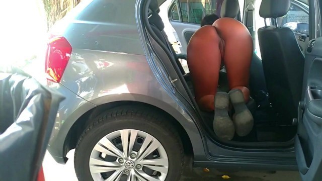 VACUUMING THE CAR AT THE GAS STATION